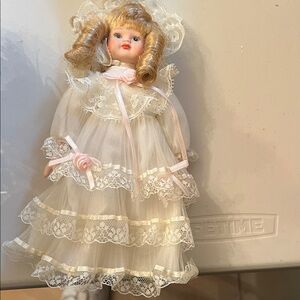 Vintage Porcelain Doll with Lace Dress